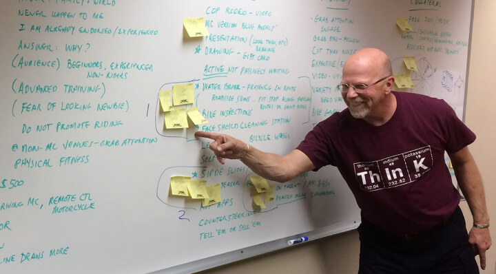 Instructor pointing to a whiteboard