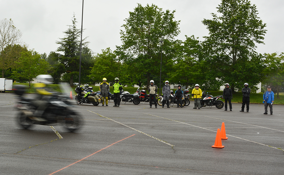 motorcyclist drives by during a class