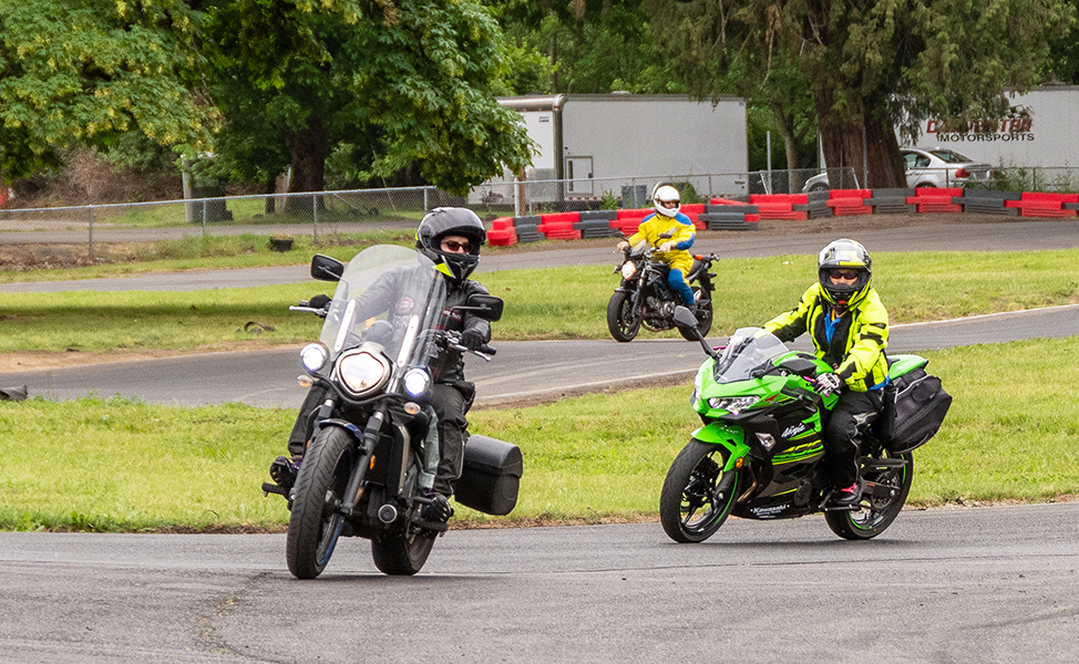 three motorcyclists on a training course