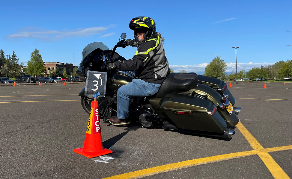 Rider turns a corner in a parking lot