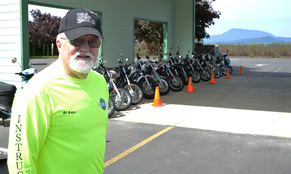 High-viz instructor with training bikes on display