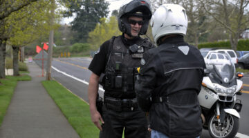 Police officer talking to motorcycle rider