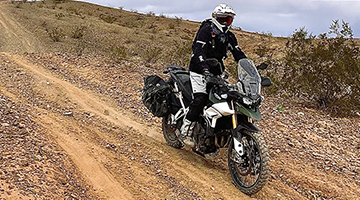Adventure rider on dirt road